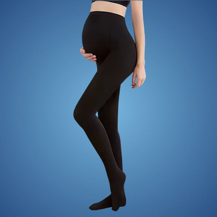 Pregnant model wearing black maternity compression tights