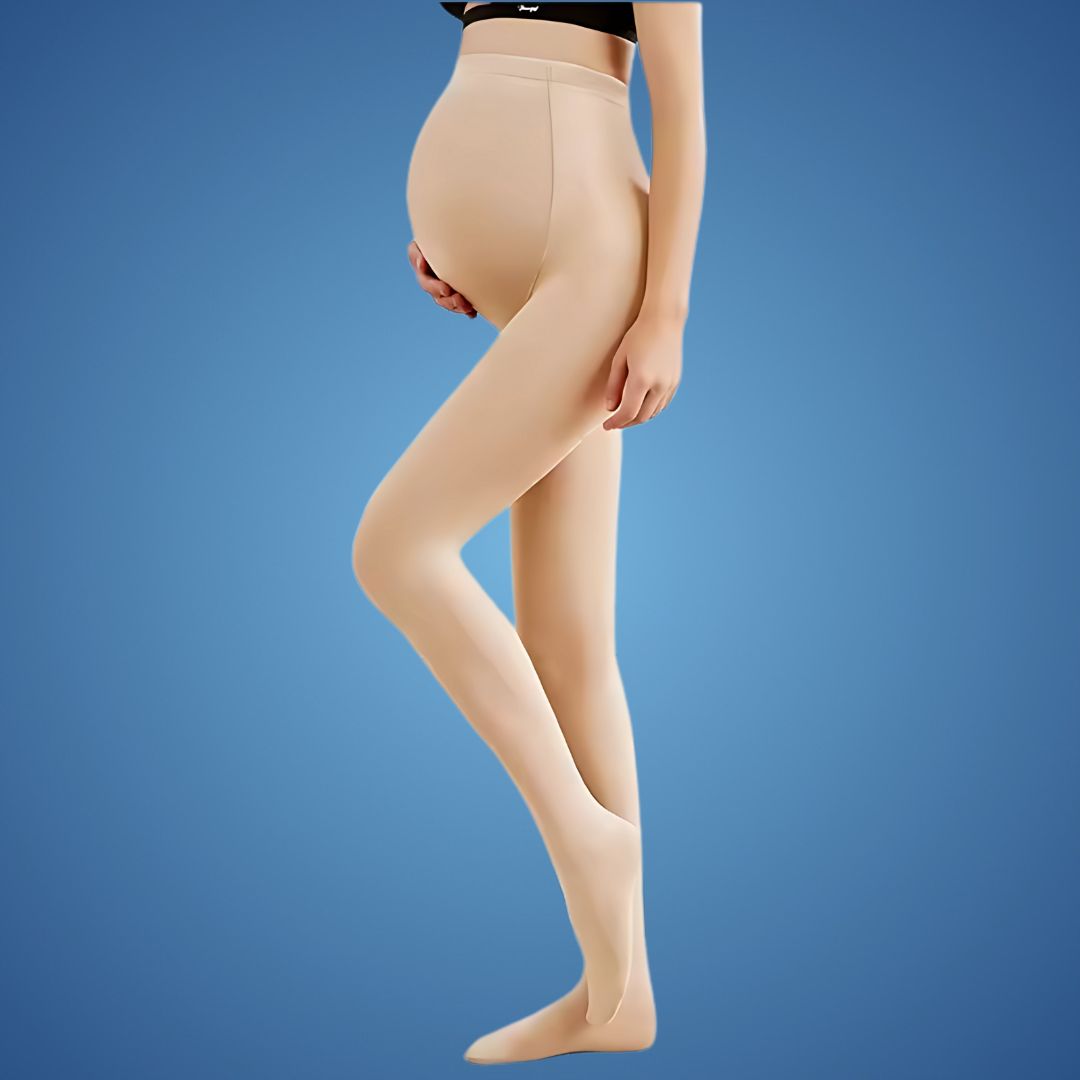 Pregnant model wearing beige maternity compression tights