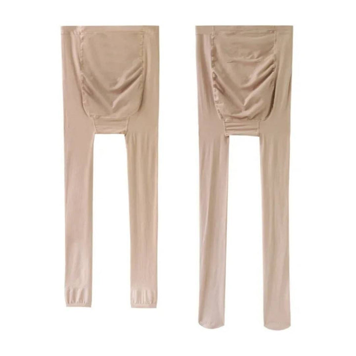 Close-up fabric detail of black maternity wear compression hosiery showing stretchy material.
