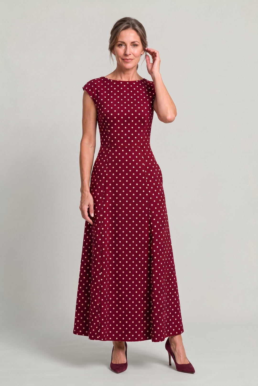 Stylish women's evening party dress with short cap sleeves and polka dots