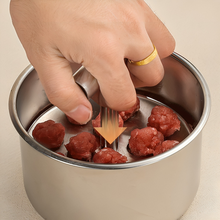 Close-up of kitchen tool shaping uniform meatballs for easy meal prep