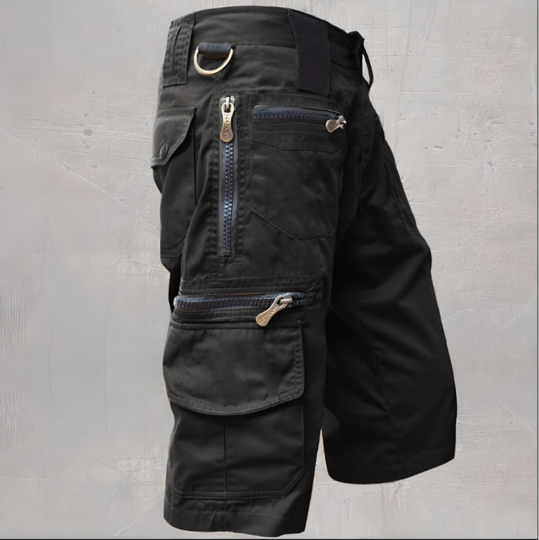 Men's black tactical cargo shorts with multiple zippered utility pockets