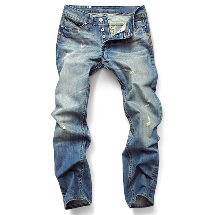 Men's classic blue denim jeans laid flat showing button fly and distressed details