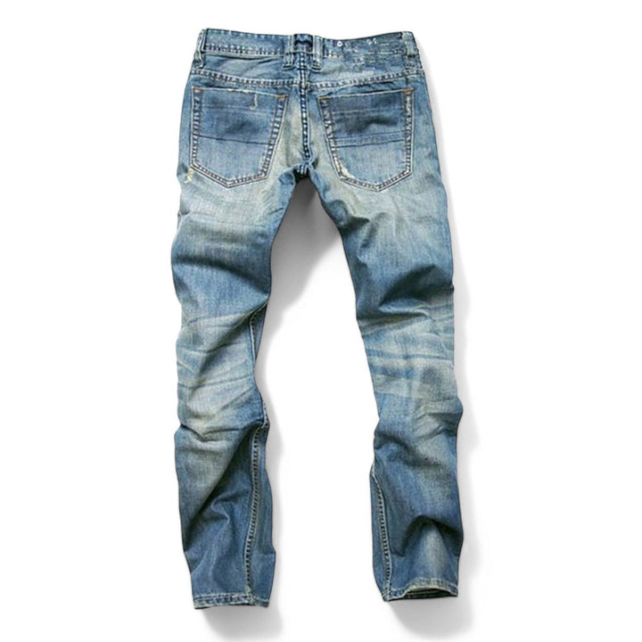 Back view of men's classic blue jeans highlighting rear pockets and waistband construction