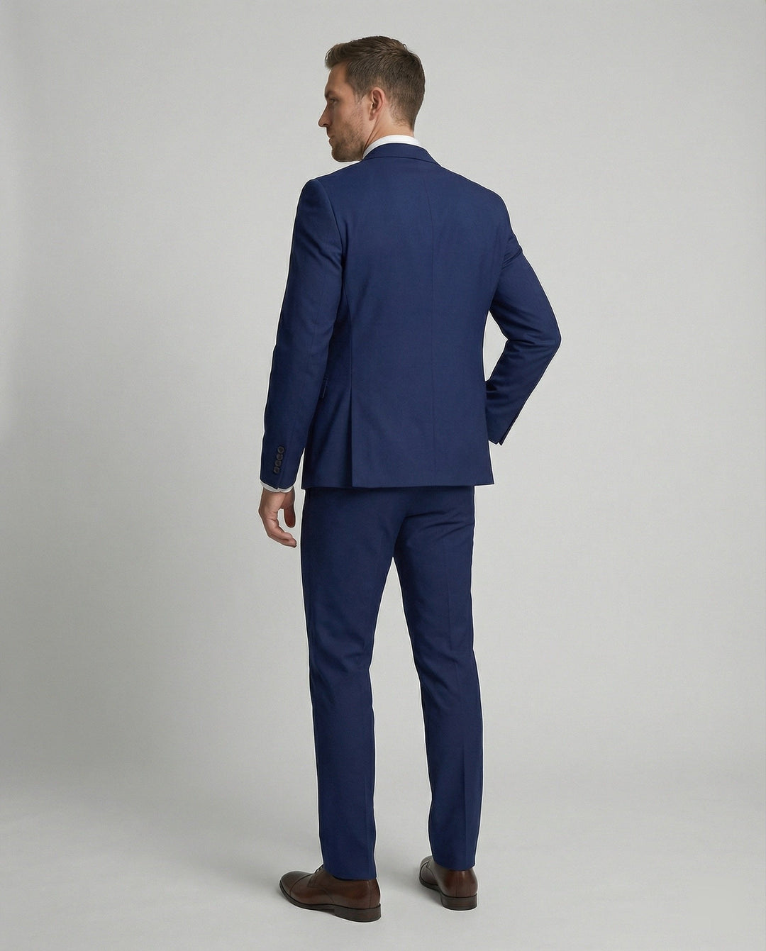 Full view of mens stylish three-piece suit styled with dress shirt
