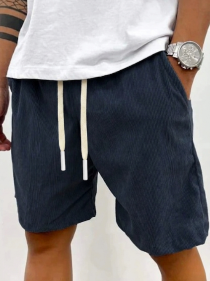 Men's blue casual drawstring shorts paired with white tee