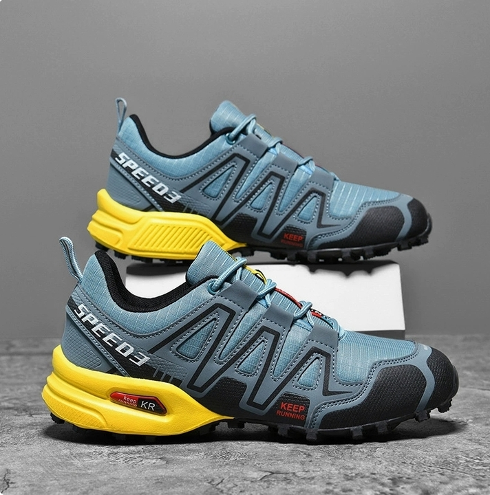 Pair of mens sports shoes styled for outdoor adventure and rocky terrain hiking