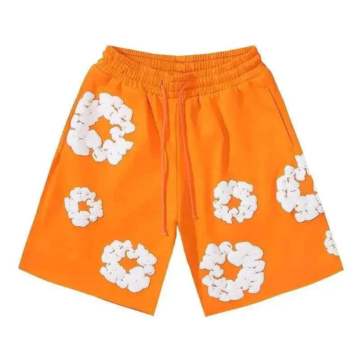 Men's vibrant orange floral streetwear shorts with side pockets