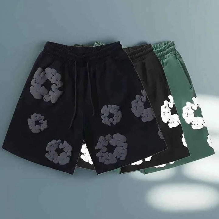 Model wearing mens floral shorts and summer streetwear outfit