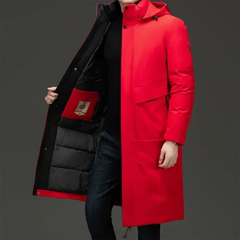 Man wearing vibrant red men's hooded long coat with zip and button details