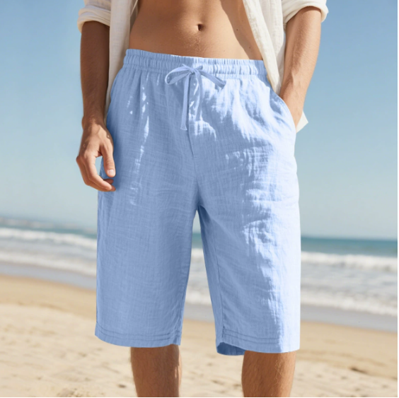 Man wearing sky blue knee length casual pull on shorts outdoors