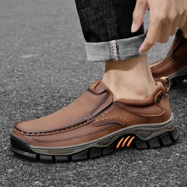 Pair of men's slip resistant orthopedic boots styled for casual everyday wear
