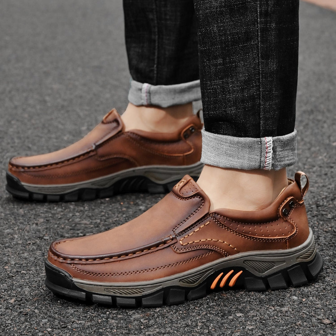 Flexible men's orthopedic transition boots bent to show sole flexibility