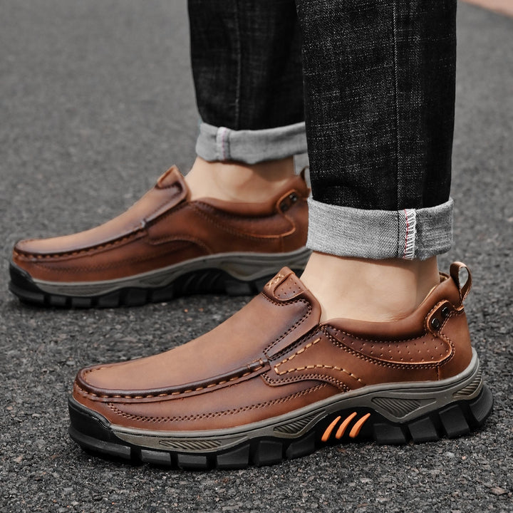 Flexible men's orthopedic transition boots bent to show sole flexibility