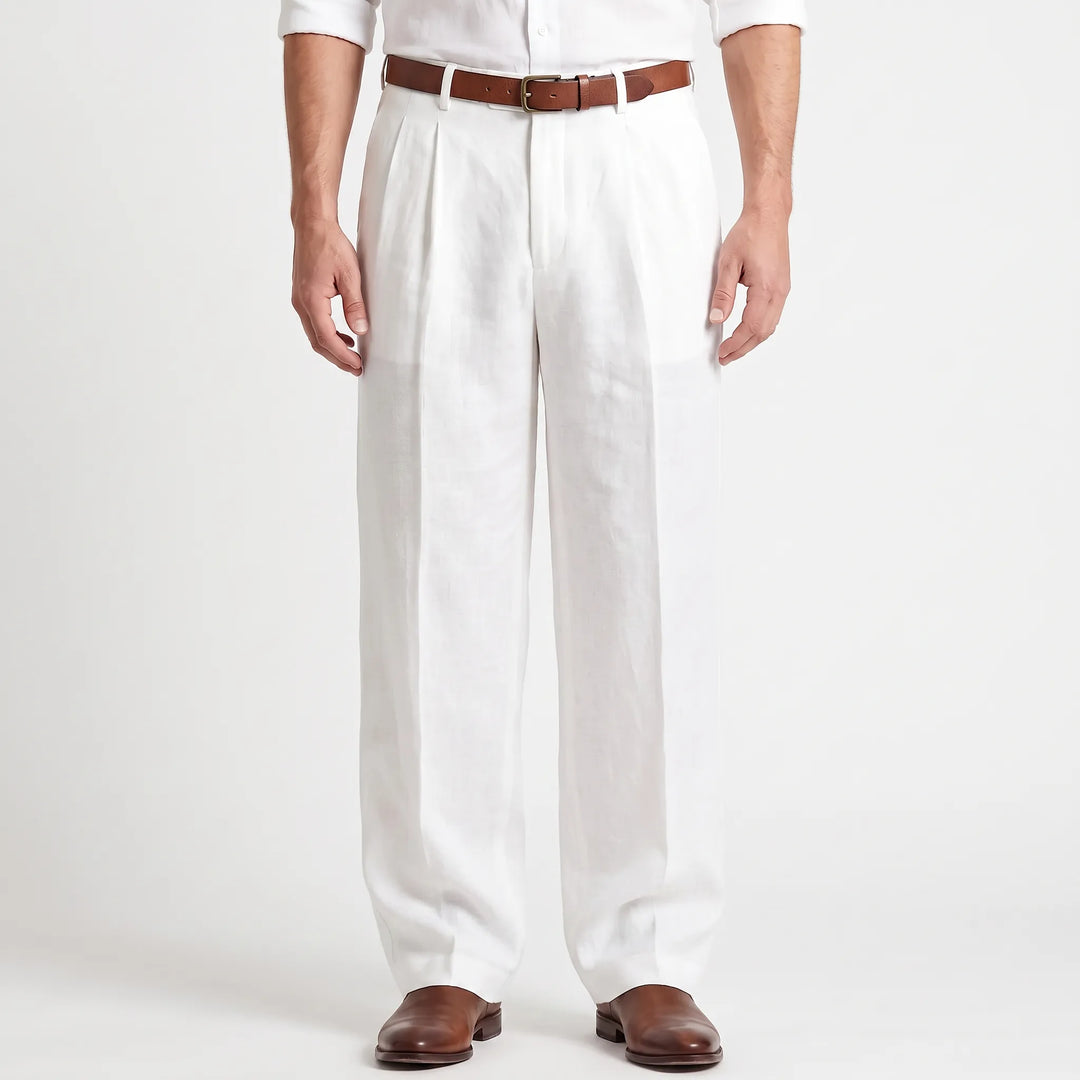 Man wearing white pleated trousers with a brown belt and leather shoes
