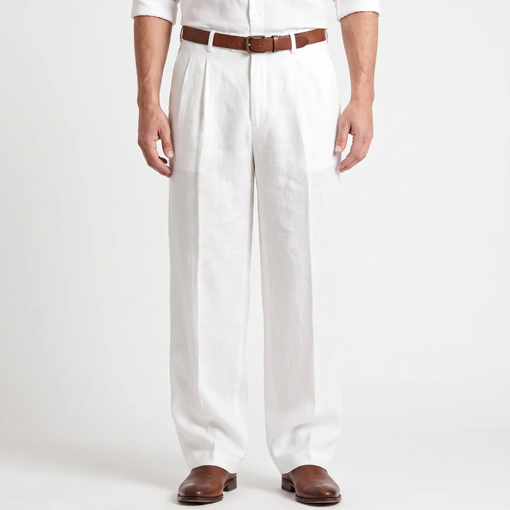 Man wearing white pleated trousers with a brown belt and leather shoes