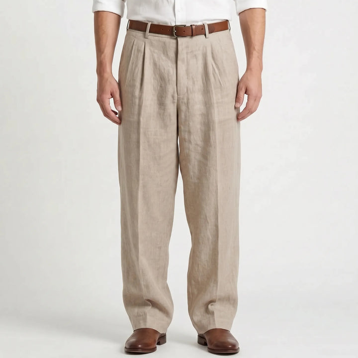 Man wearing khaki pleated trousers with a brown belt and leather shoes