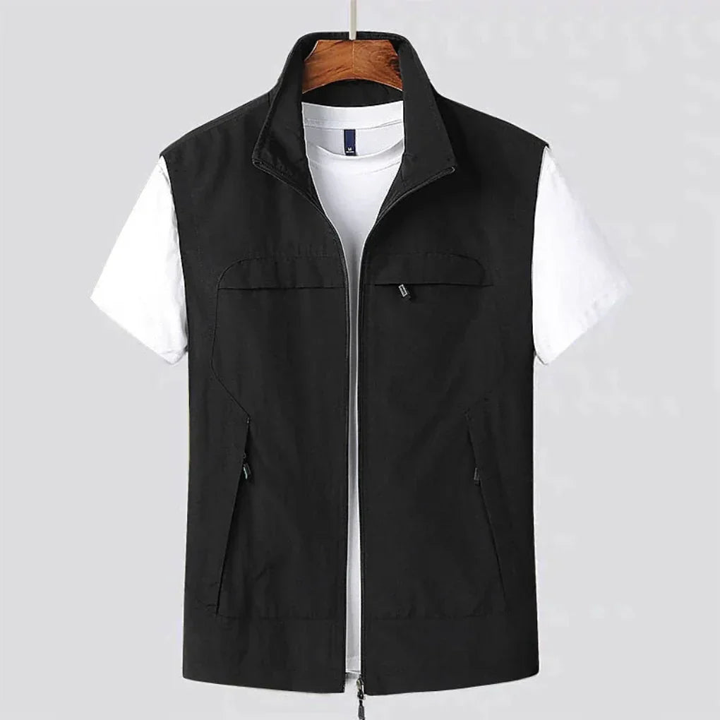Men's black quick-dry outdoor utility vest displayed on hanger