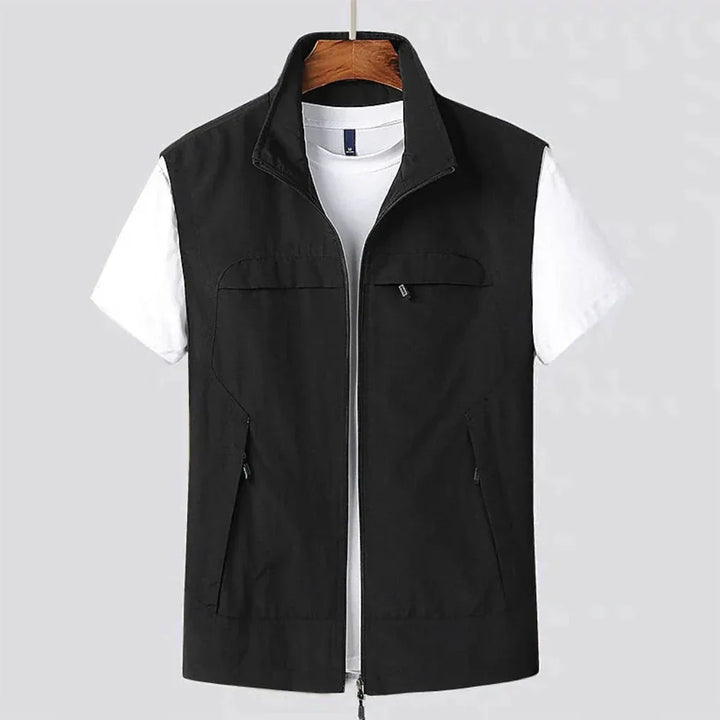 Men's black quick-dry outdoor utility vest displayed on hanger