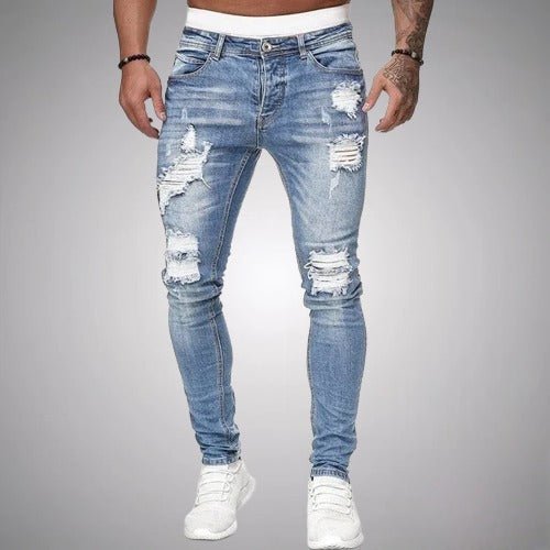 Man wearing light blue distressed skinny jeans