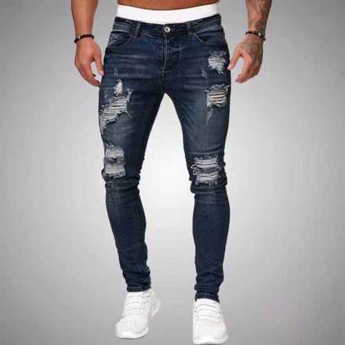 Mens skinny ripped jeans featuring distressed denim details and streetwear style casual trousers.