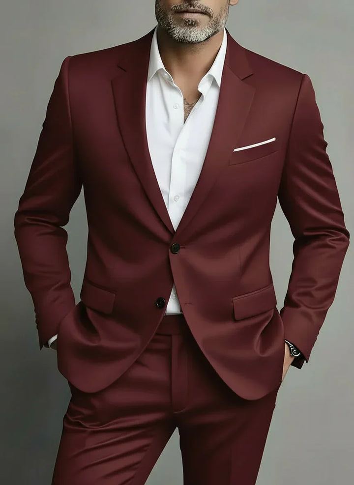 Man wearing a wine red slim fit two-piece suit with a white shirt