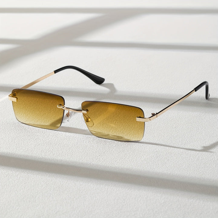 Orange tinted frameless sunglasses featuring a sleek metal frame design
