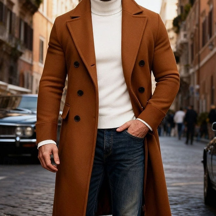 Close-up of a man in a brown long double-breasted overcoat and tailored fit trousers