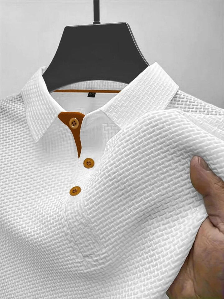 Close-up of white men's textured woven short-sleeve polo shirt showing collar detail