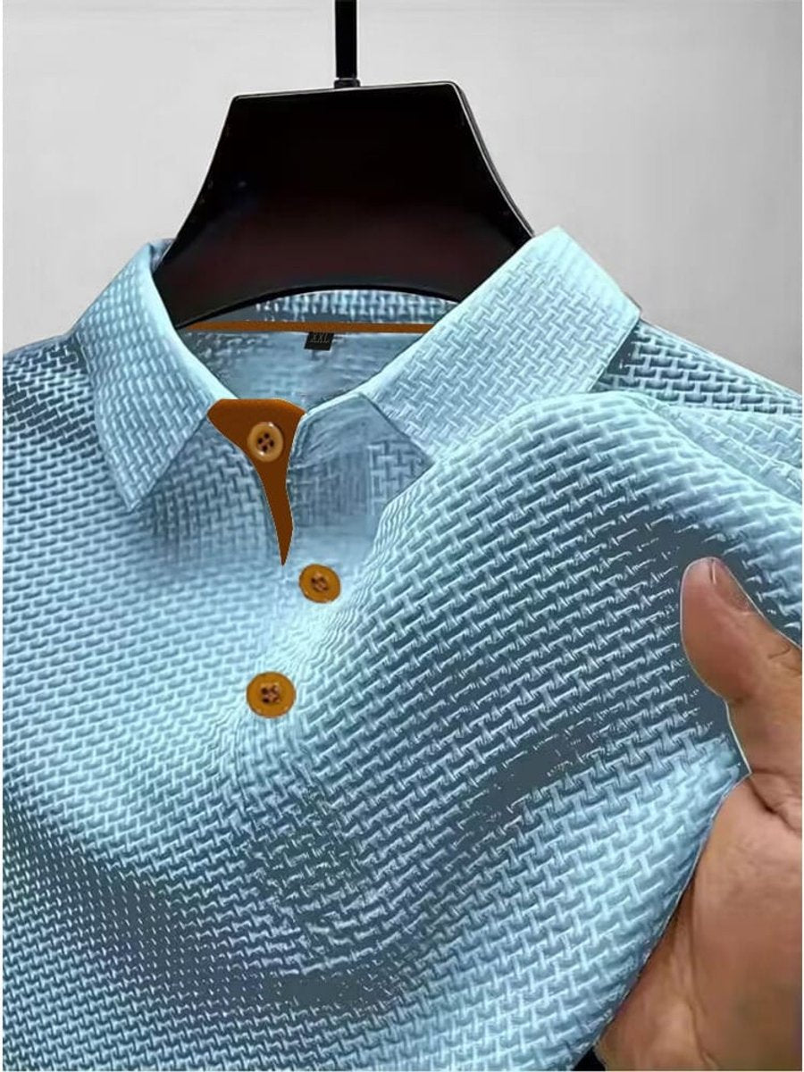 Close-up of the woven texture and collar on a mens short-sleeve summer polo