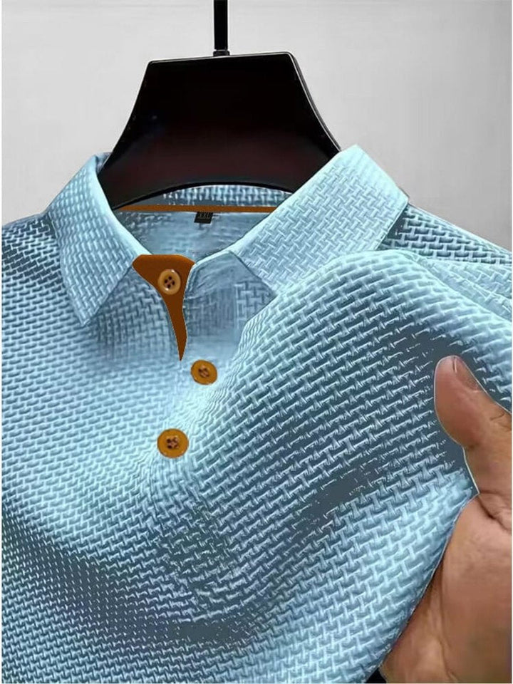 Close-up of the woven texture and collar on a mens short-sleeve summer polo