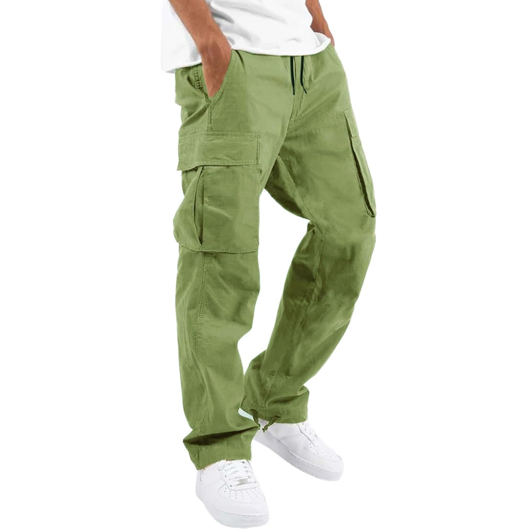Man wearing olive green cargo joggers with white sneakers