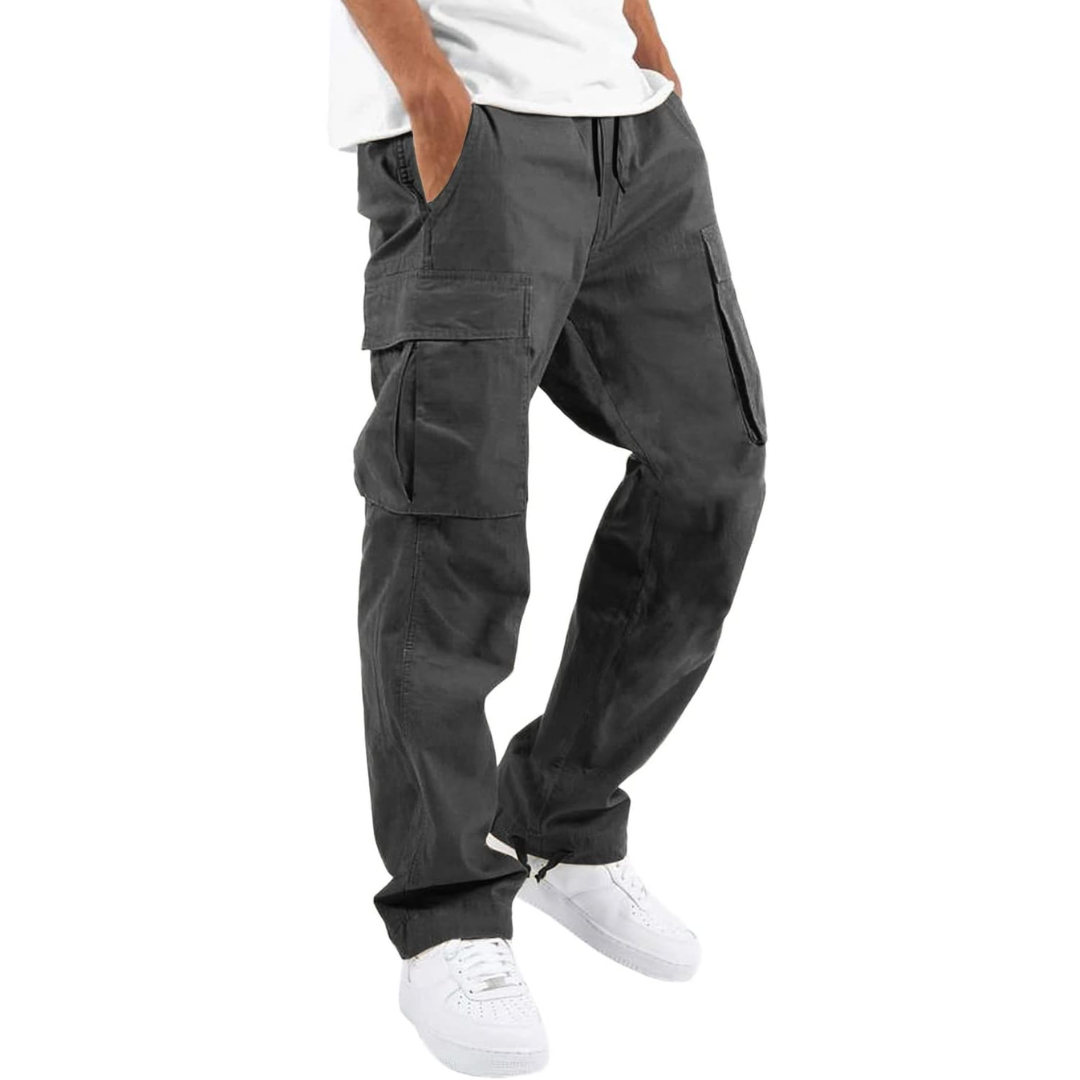 Mens casual cargo pants in black styled with athletic sneakers