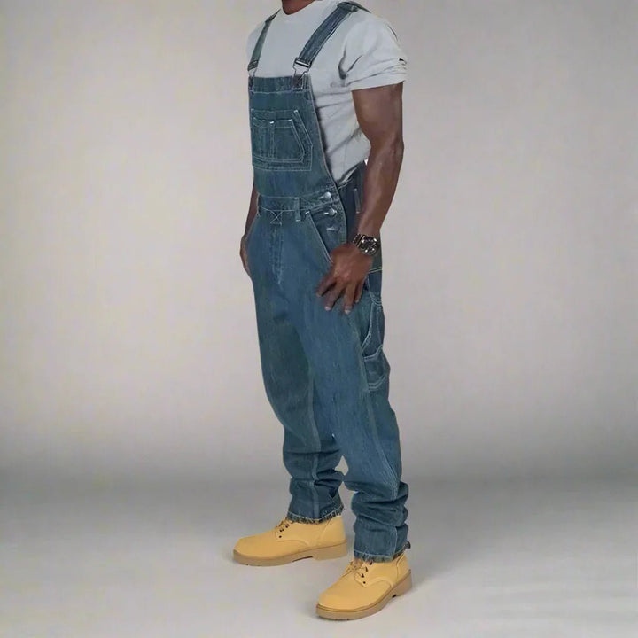 Casual mens workwear style denim overalls with contrast splice panels, full view.