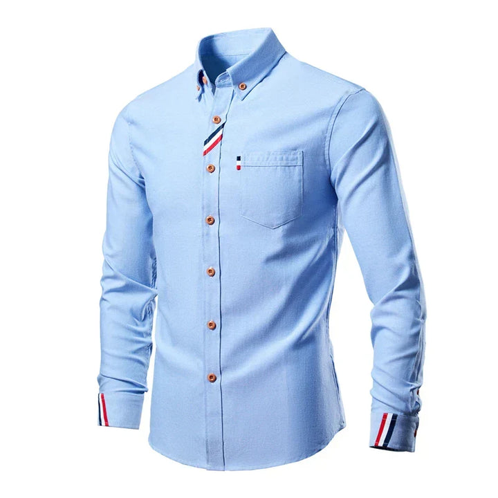 Men's long-sleeve light blue button-down shirt featuring chest pocket