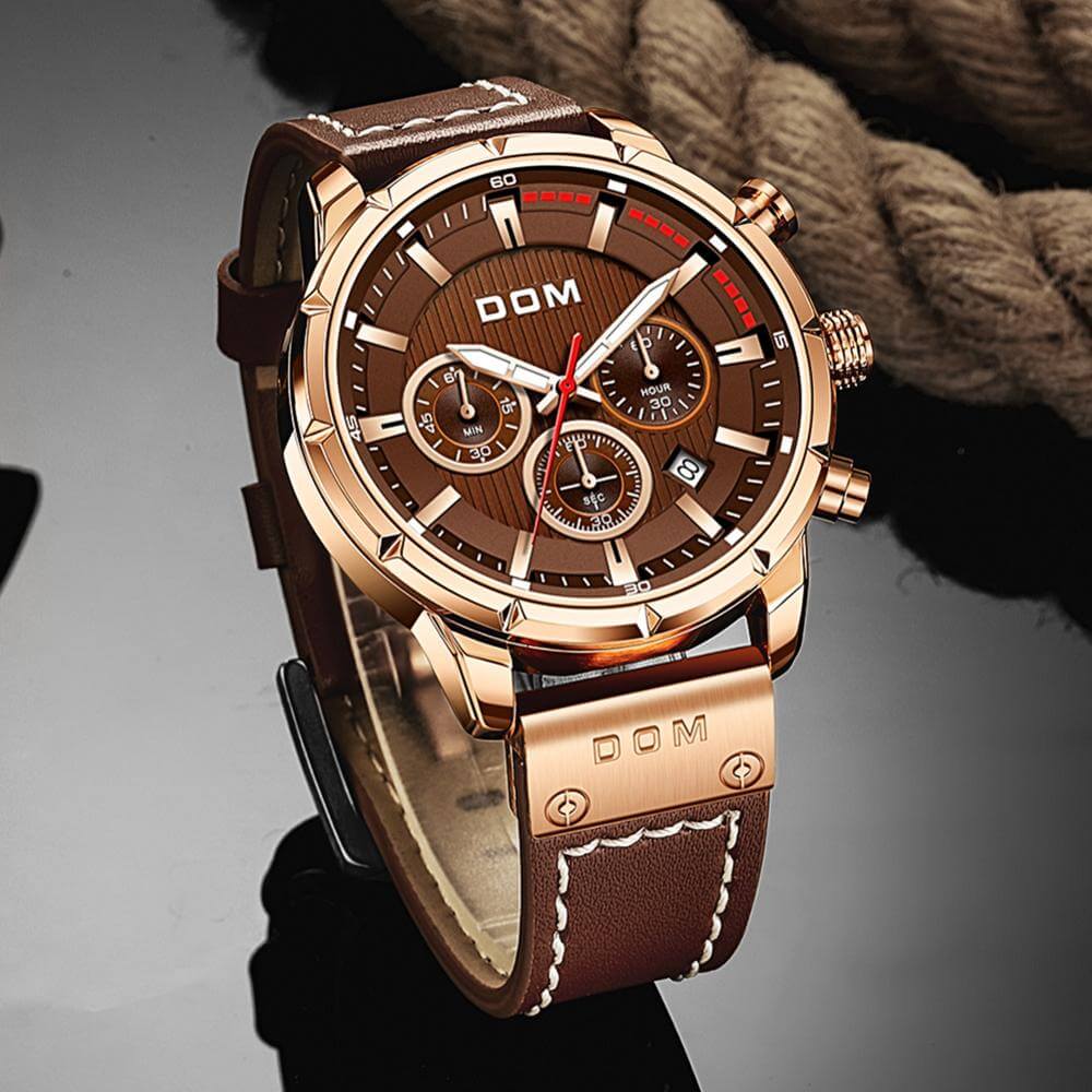 Men's brown rose gold luminous sports watch close up dial view