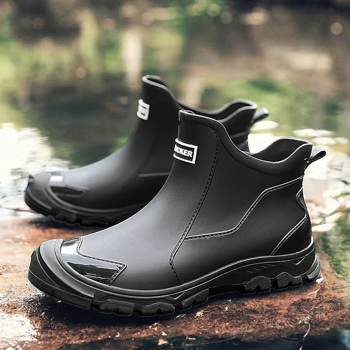 Close-up of black insulated waterproof ankle boots with textured grip sole