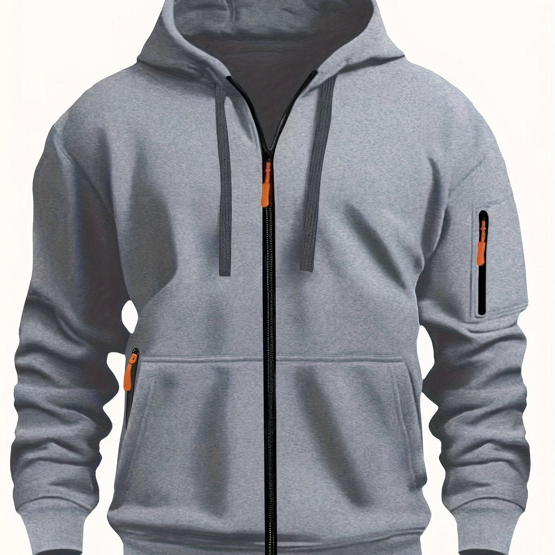Flat lay of mens clothing essentials featuring zip up hoodie