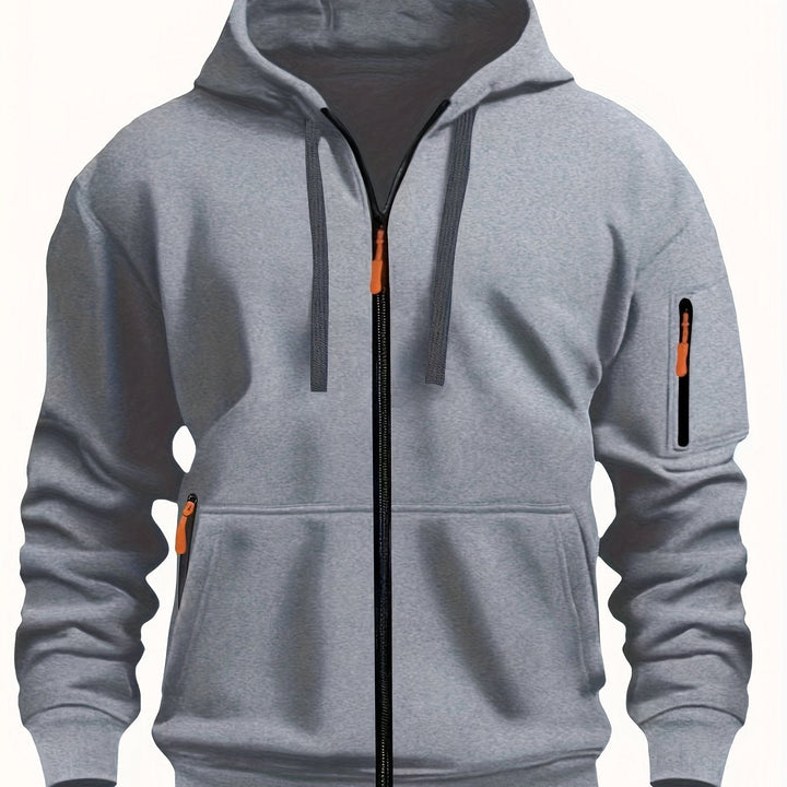 Flat lay of mens clothing essentials featuring zip up hoodie