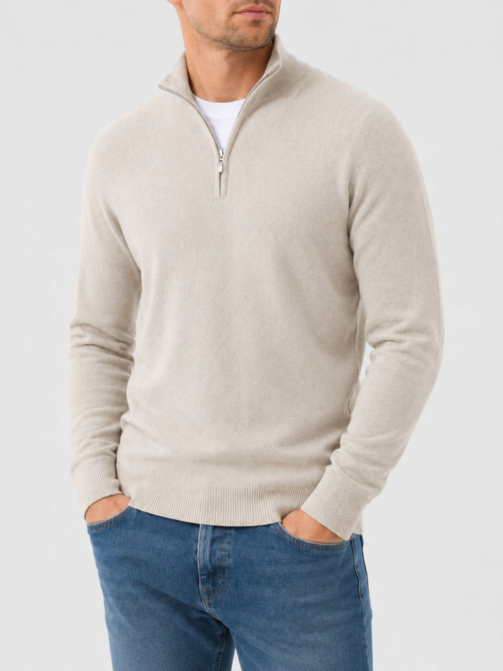 Man wearing beige V-neck jumper with zip detail
