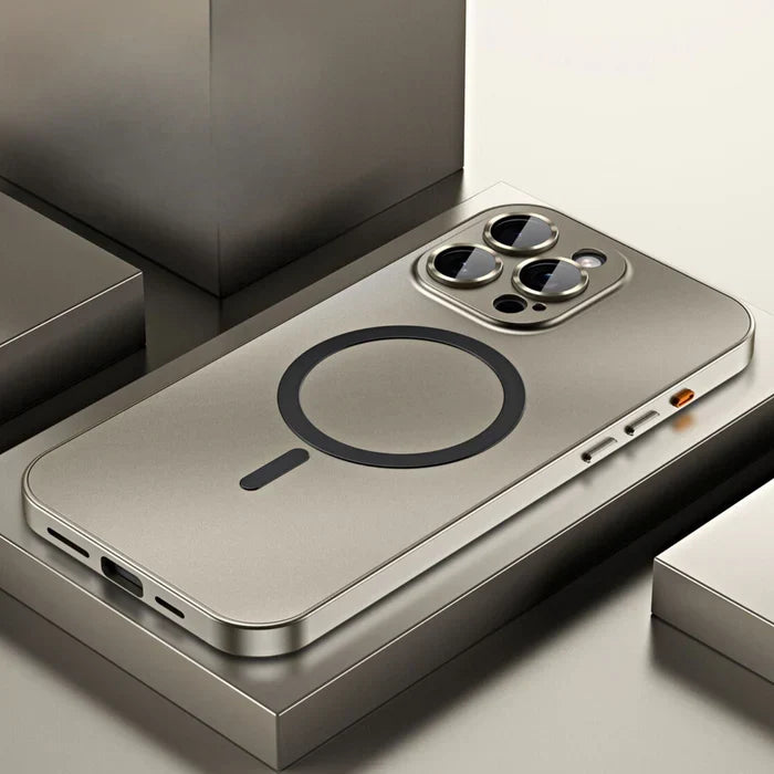 Gold magnetic metal phone case for iPhone resting on a modern geometric surface
