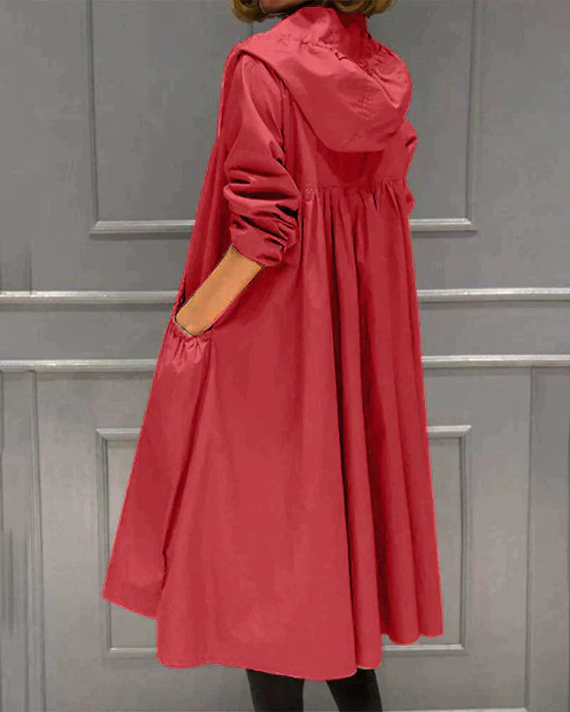 Back view of longline hooded outerwear for women showcasing tailored fit