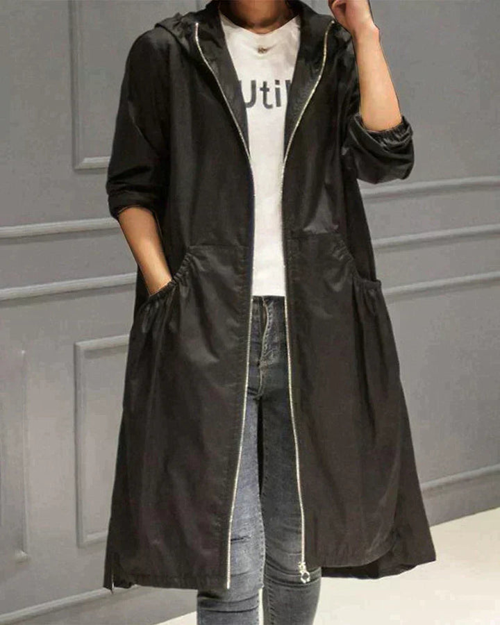 Side view of women longline hooded jacket showing full length outerwear cut