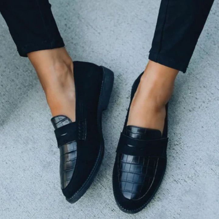 Top down view of women's black Mila loafers showcasing the textured toe design