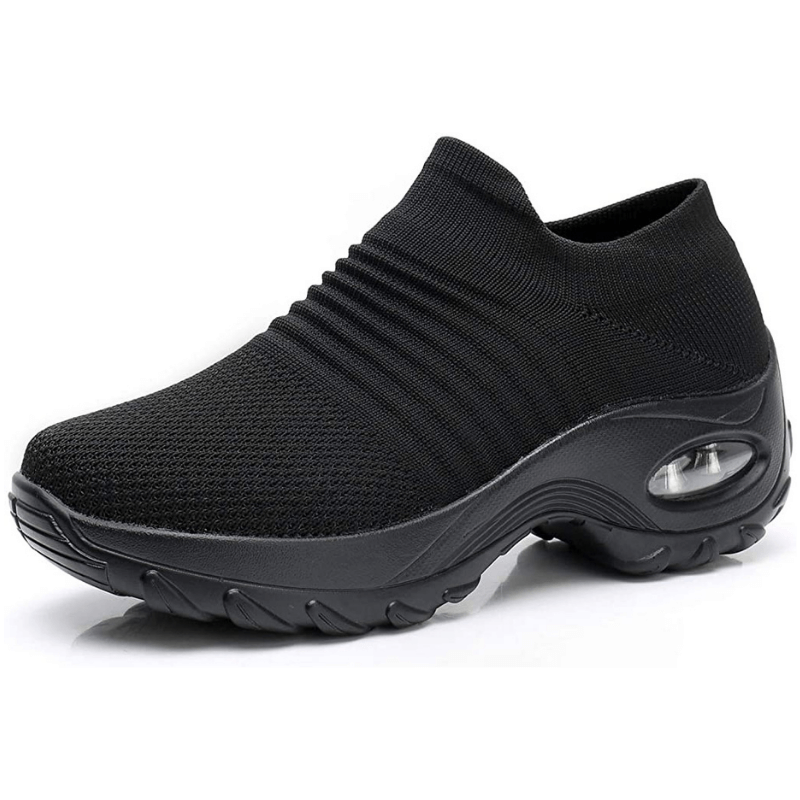 Women's black orthopedic walking sneaker with air cushion sole viewed from side