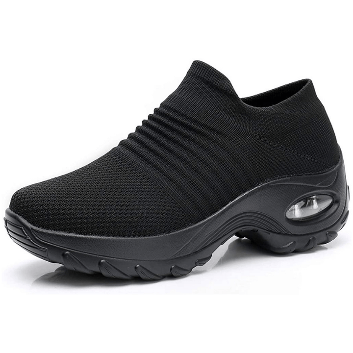 Women's black orthopedic walking sneaker with air cushion sole viewed from side