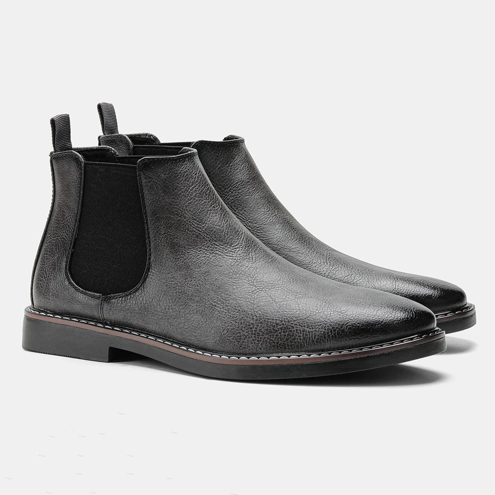 Casual footwear for men showing side profile of pull-on chelsea boots with elastic panels