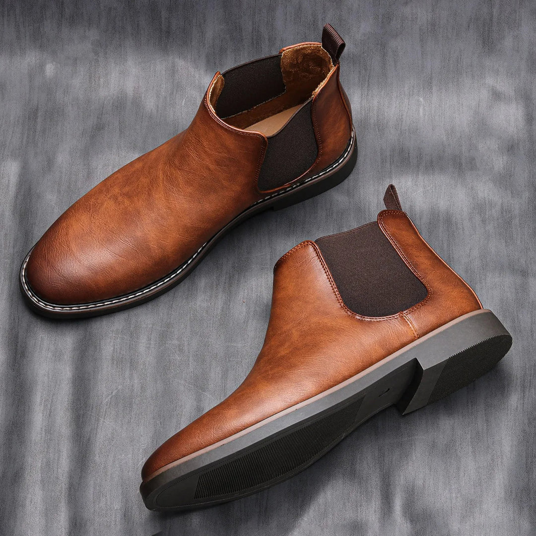 Milo men's brown pull-on Chelsea boots displayed on a grey textured background