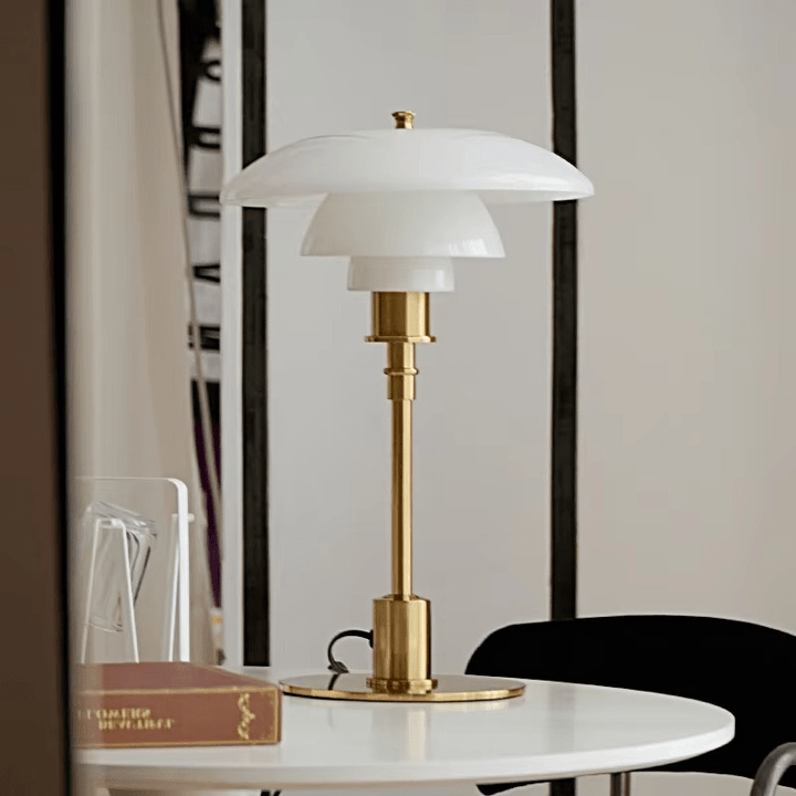 Sleek bedside lighting fixture featuring a clear glass globe shade
