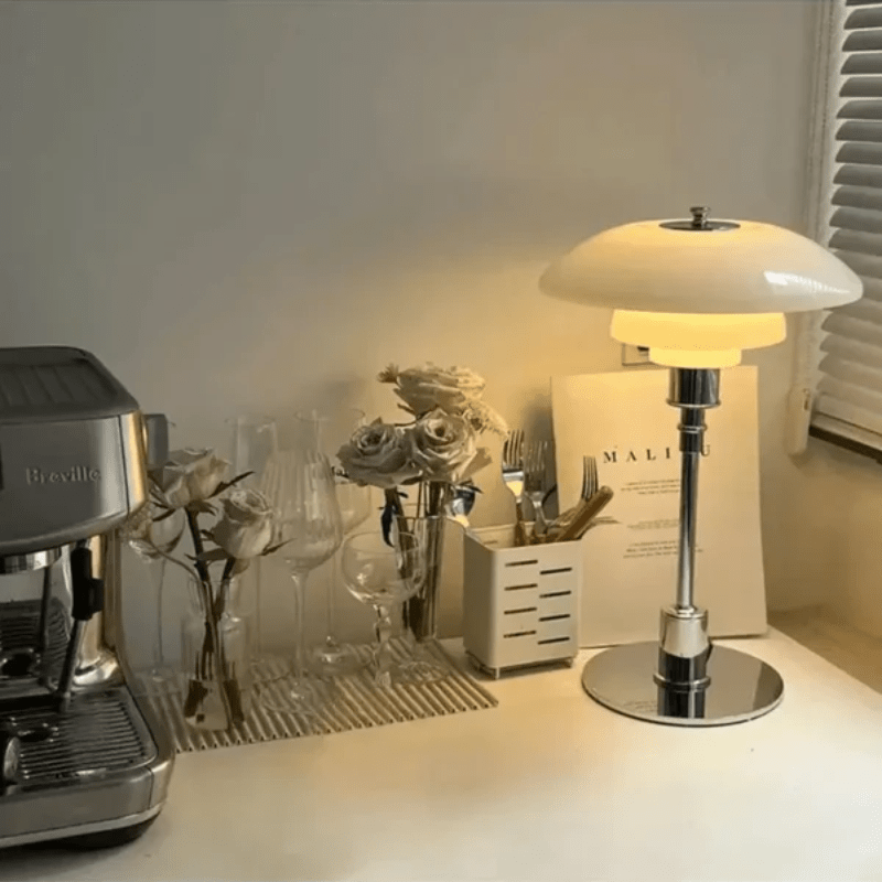 White glass shade table lamp illuminating a cozy kitchen counter setup
